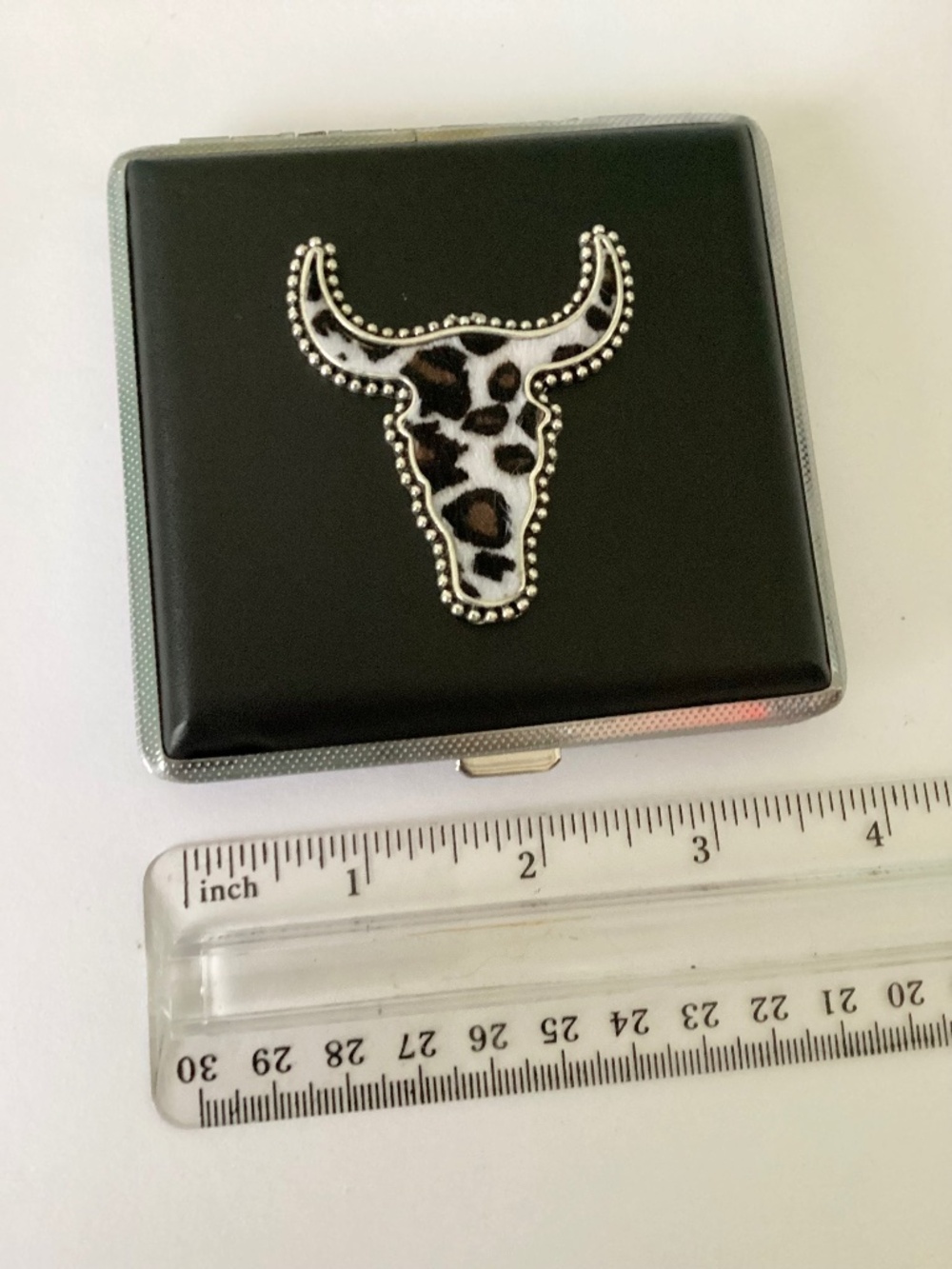 Faux leather metal case with steer head accent. One of a kind, hand crafted